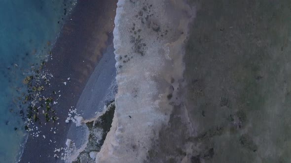 Bird's Eye View Looking Down from a High Cliff Edge to the Sea Below