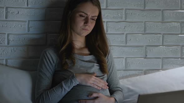 Pregnant Female With Laptop at Night Feeling Head Ache Influence of Technology