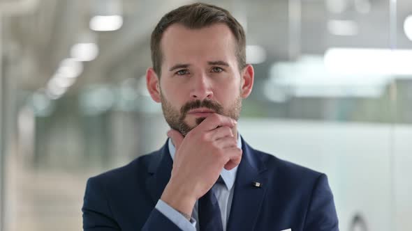 Portrait of Pensive Businessman Thinking New Plan