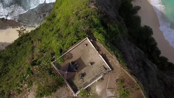 Breathtaking aerial view slowly tilt up drone flight at magical mystic placeKelingking Beach at Nus