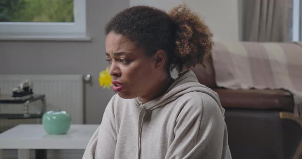 Anxious Sick African American Woman Looking Around with Scared Facial Expression Screaming