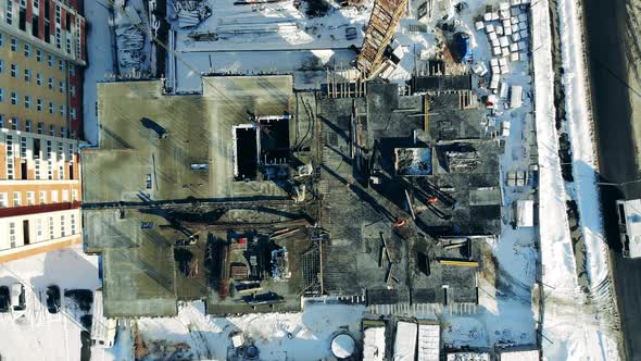 Top View of an Unfinished Urban Building with Constructors. Construction Industry, Monolithic Frame