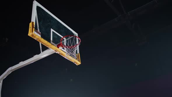 Basketball Training Game Man Player Successfully Throws a Basketball Into the Basket Low Angle View