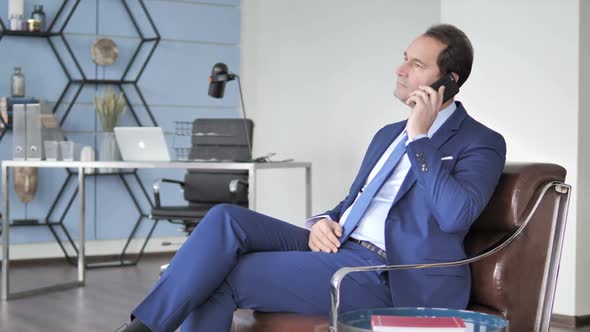 Businessman Talking on Phone