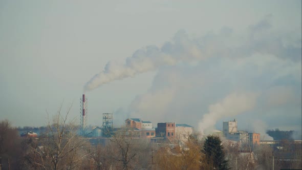 High Pollution the Atmosphere with Smoke and Smog From Chemical Factory with Smoke Stack. Global