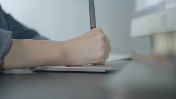 Graphic Designer Working With Pen Tablet And Computer