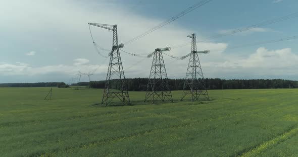 Power Line Industrial View on the Line of Electric Transmissions in Field Steel Towers with Wires