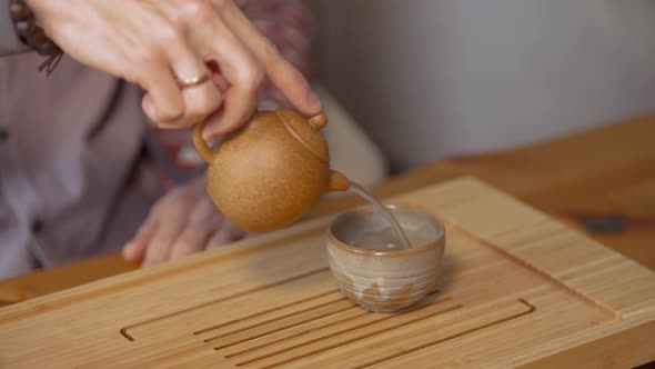 Close-up of man pouring Chinese tea