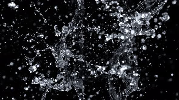 Super Slow Motion Shot of Abstract Water Splash Isolated on Black Background at 1000Fps