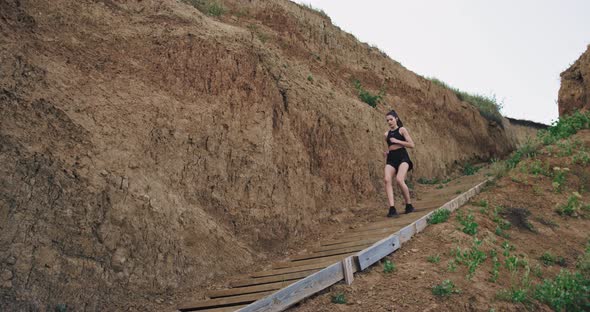 A Young Athletic Woman , Runs Down a Couple of