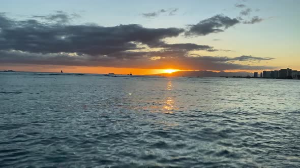 Moving timelapse of colorful sunset at Waikiki beach in Oahu Hawaii