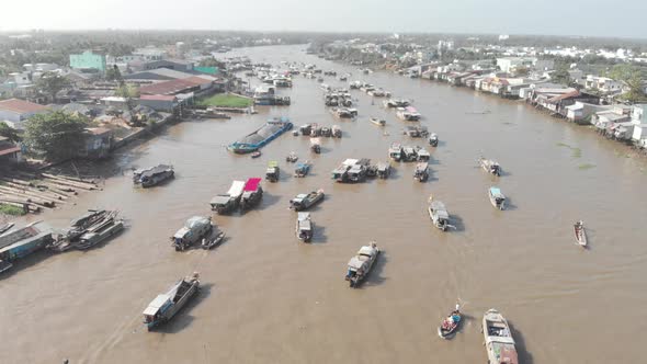 Aerial: rotating panorama over Cai Rang floating market Can Tho Vietnam