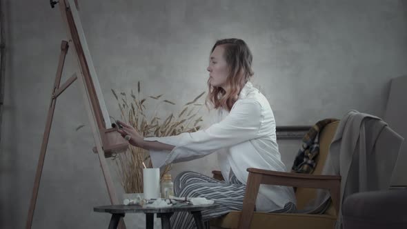 Woman Artist Paints At Home