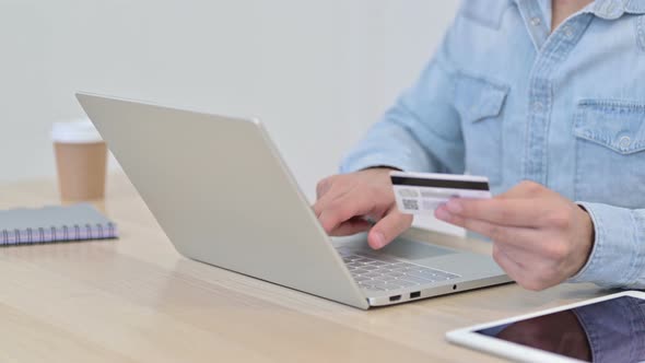 Man Celebrating Online Payment on Laptop, Close Up