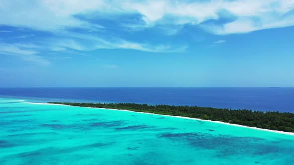 Aerial drone seascape of idyllic coastline beach trip by clear sea with bright sand background of jo