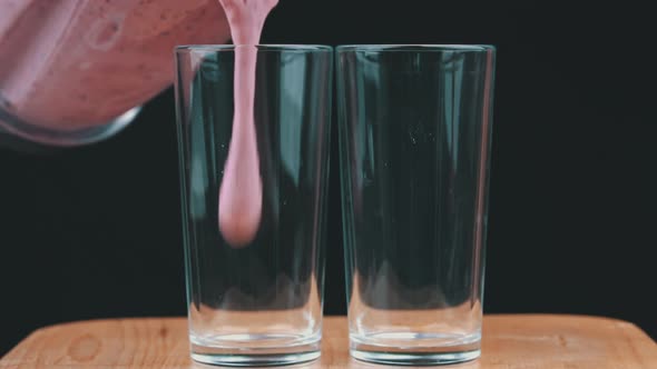 Milkshake with Berries is Poured Into Glasses