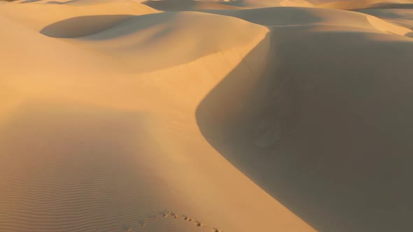  Aerial Drone Flying Over Magical Waves of Sand Dunes in Golden Sunset Light
