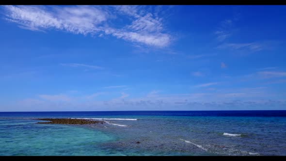 Aerial drone shot texture of luxury tourist beach lifestyle by blue lagoon and white sandy backgroun