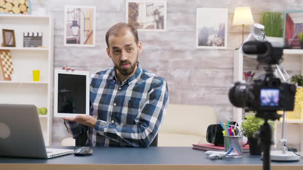 Famous Young Influencer Filming Review of Tablet