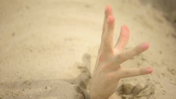 Hand Desperately Waving, Sinking in Quicksand, Trapped Tourist in Desert, Danger