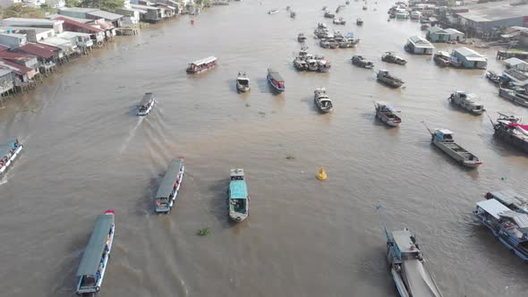 Aerial: rotating panorama over Cai Rang floating market Can Tho Vietnam