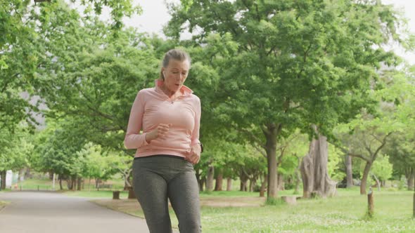 Senior woman running in the park