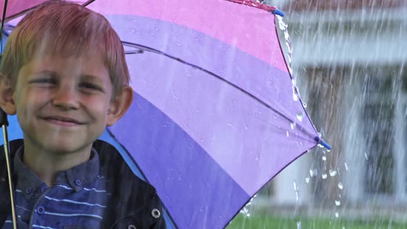Little Boy with Umbrella Posing alt