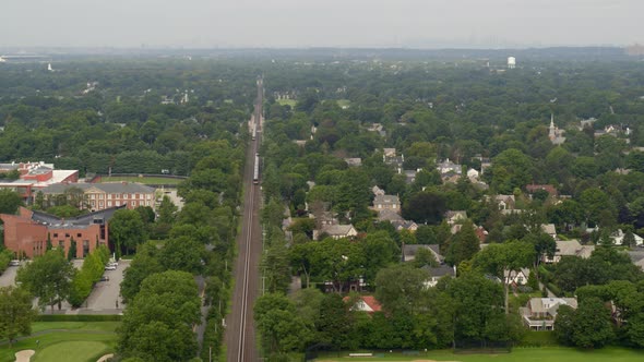 Aerial of a Train Passing Through Garden City Long Island