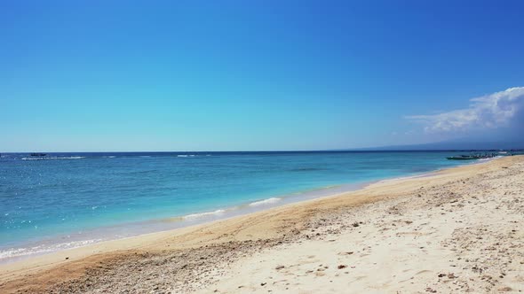 Tropical above island view of a sunshine white sandy paradise beach and blue sea background in high 