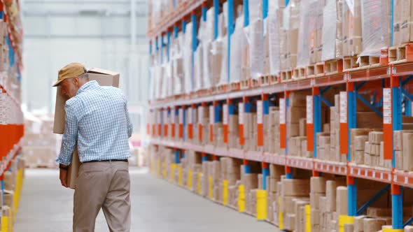 Warehouse worker holding packages