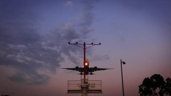 Jet Landing At Sunset