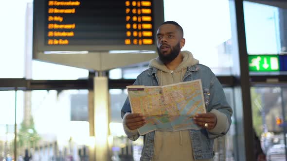 Slowmo Handsome Black Guy Bearded Standing Airport Station Holding Map Foreign Language Travelling