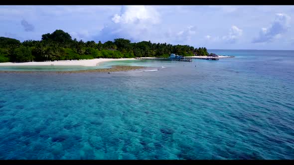 Aerial seascape of beautiful coast beach adventure by turquoise sea with white sandy background of a