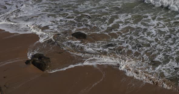 Waves splashing on  the beach Le Pouldu, Finistere department, Brittany, France