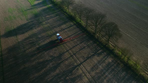 Spraying Machine Working Fields on an Arable Farm with Glyphosate Herbicide