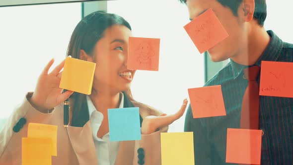 Business People Work on Project Planning Board