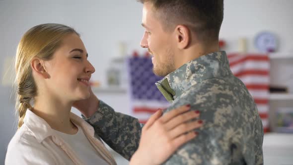 Happy Female Hugging Soldier Boyfriend Coming Home After Military Service, Love