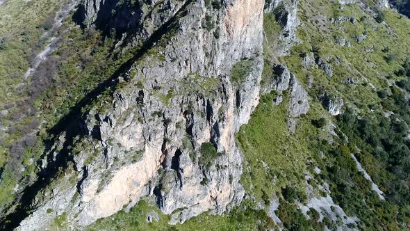 Drone approach to Cave mountains rocks of the Hobbit