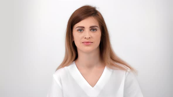 Portrait Woman Patient with Natural Beauty in White Shirt Posing Isolated at Medical Clinic Closeup