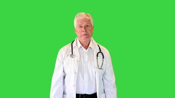 Senior Doctor with Stethoscope Walking on a Green Screen Chroma Key