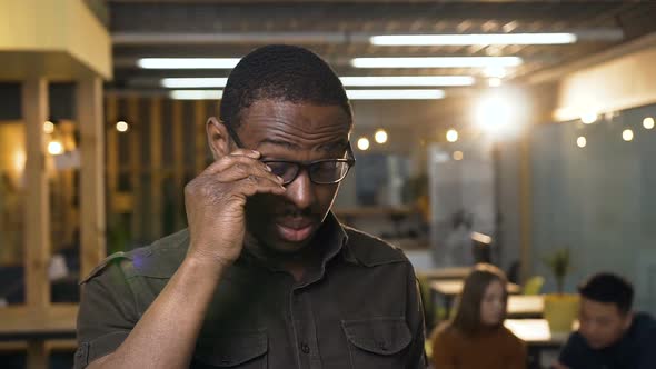 Portrait of African Business Man Wearing Glasses and Looking to the Camera