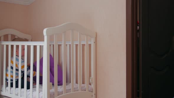Boy In Crib