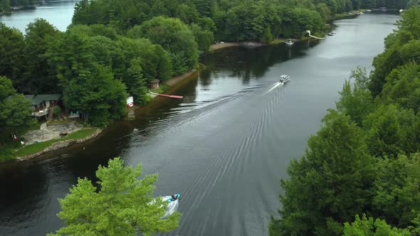Aerial view of seadoo riding down Muskoka river in cottage country