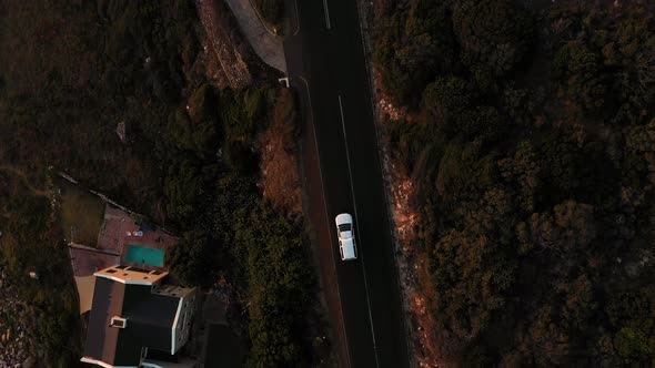 Aerial view of road crossing Scarborough Beach at sunset, South Africa.