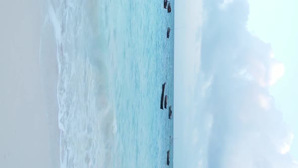 Vertical Video Boats in the Ocean Near the Coast of Zanzibar Tanzania Aerial View