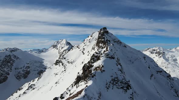 Aerial View of Cheget Mountain Range in Snow in Winter in Sunny Clear Weather