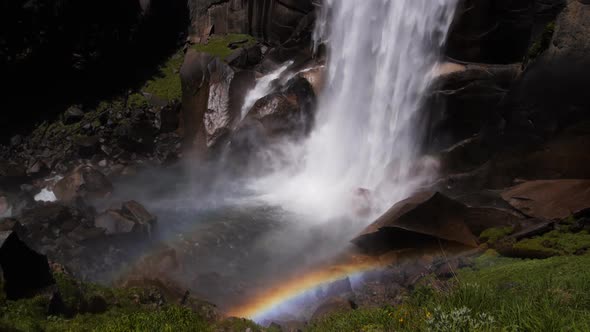 rainbow at the base of vernal falls on the mist trail in yosemite