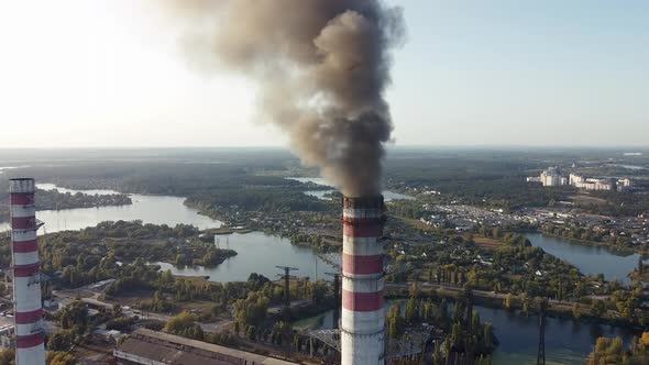 Environmental pollution by industrial plants throwing out harmful smoke from the chimney