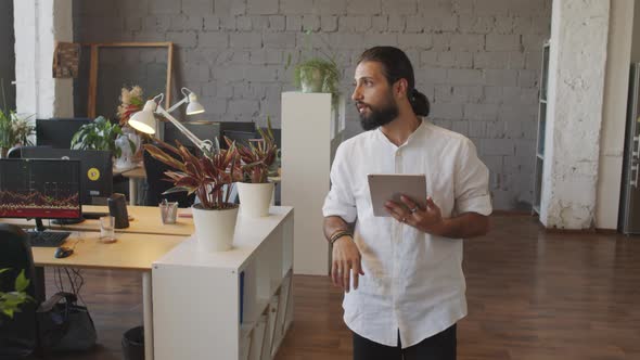 Office Worker with Tablet Computer Walking