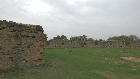 A Ruined Wall Made of Bricks and Stones